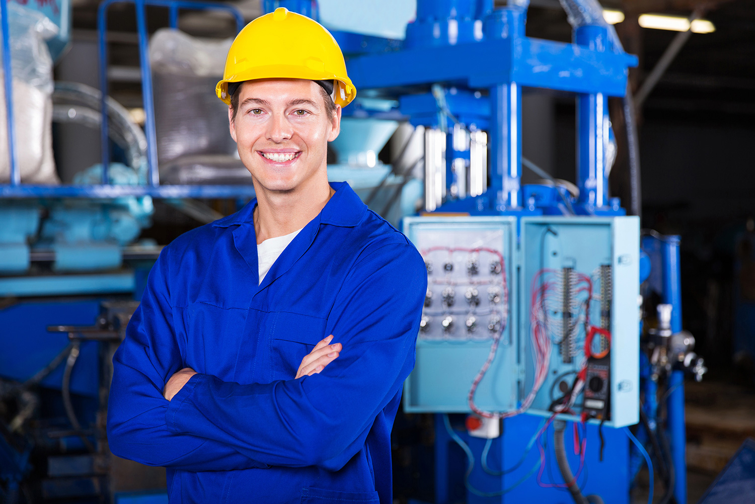 Happy worker inside a factory